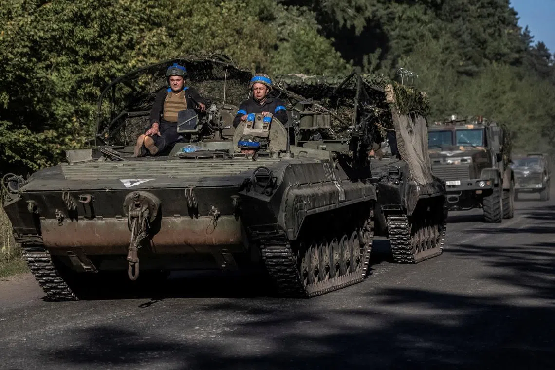 Ukrainian servicemen ride an armoured personnel carrier, amid Russia's attack on Ukraine, near the Russian border in Sumy region, Ukraine August 14, 2024. REUTERS/Viacheslav Ratynskyi/File Photo