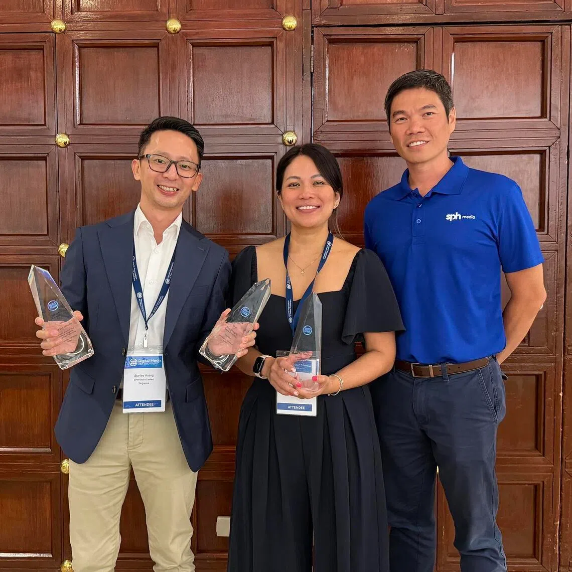 (From left) The Straits Times' assistant audience growth editor Stanley Huang, SPH Media’s Studio+65 head Michell Tan and SPH Media deputy chief executive officer Kuek Yu Chuang celebrating ST's double win.