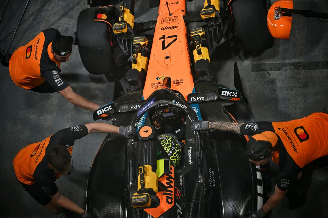 McLaren'S Lando Norris at the pit during the qualifying session of the 2025 Formula One Singapore Airlines Singapore Grand Prix at the Marina Bay Street Circuit on Oct 4, 2025. 