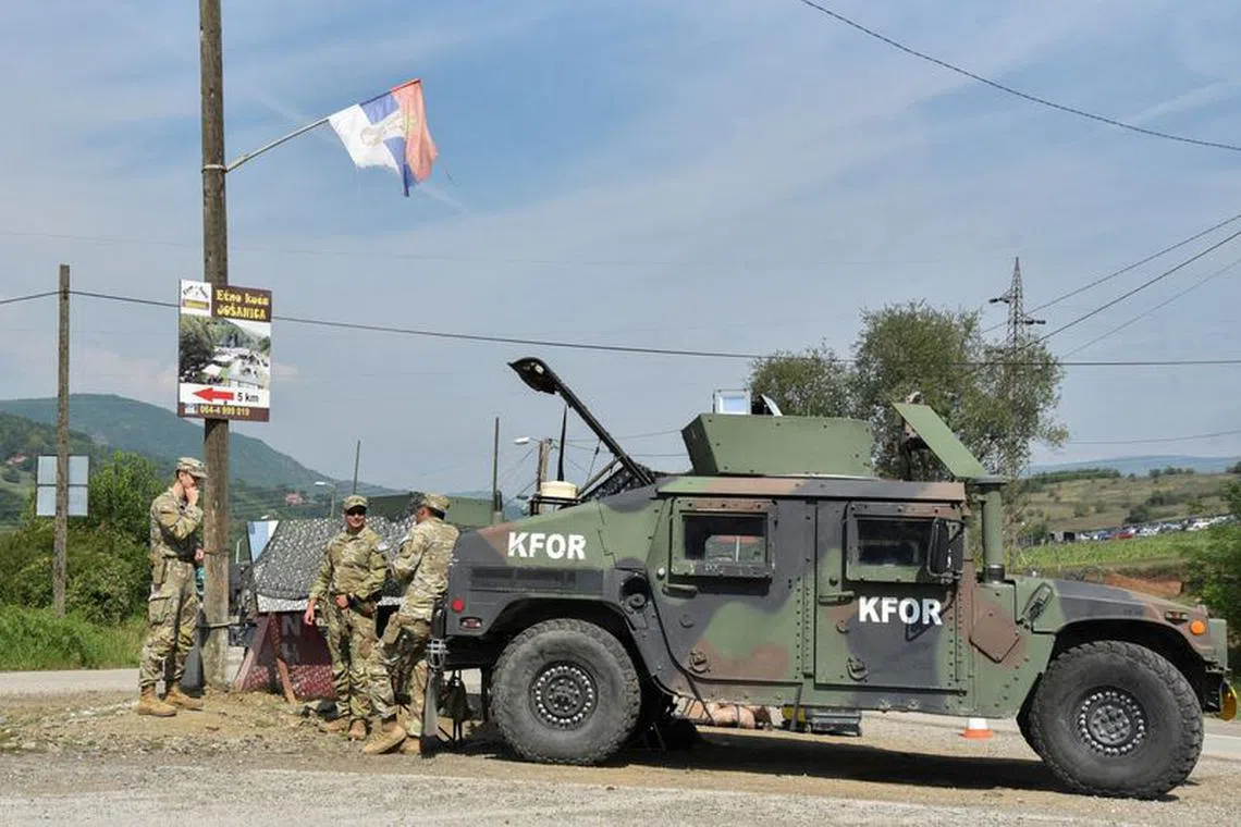 FILE PHOTO: Members of the KFOR peacekeeping force patrol the area near the border crossing between Kosovo and Serbia  in Jarinje, Kosovo,September 1, 2022. REUTERS/Laura Hasani/File Photo