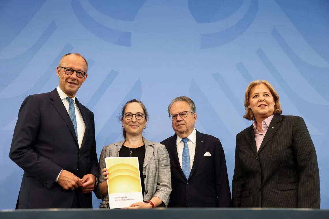 German Chancellor Friedrich Merz, Labour Minister Baerbel Bas, Constanze Janda, and Frank-Jurgen Weise pose at a press conference on the day they present the  Pension Security Commission (Alterssicherungskommission) report, at the Chancellery in Berlin, Germany, June 23, 2026. REUTERS/Nadja Wohlleben