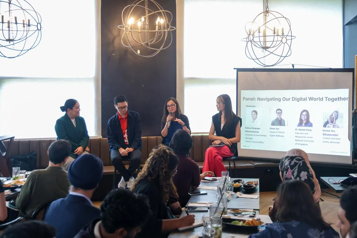 Ms KahnJi Siriprapa Weerachaising, manager of outreach and partnerships at TikTok’s trust and safety department, moderating a panel discussion with Mr Shem Yao, head of TOUCH Cyber Wellness, Dr Natalie Pang, head of the department of Communications and New Media at NUS, and content creator Denise Teo.