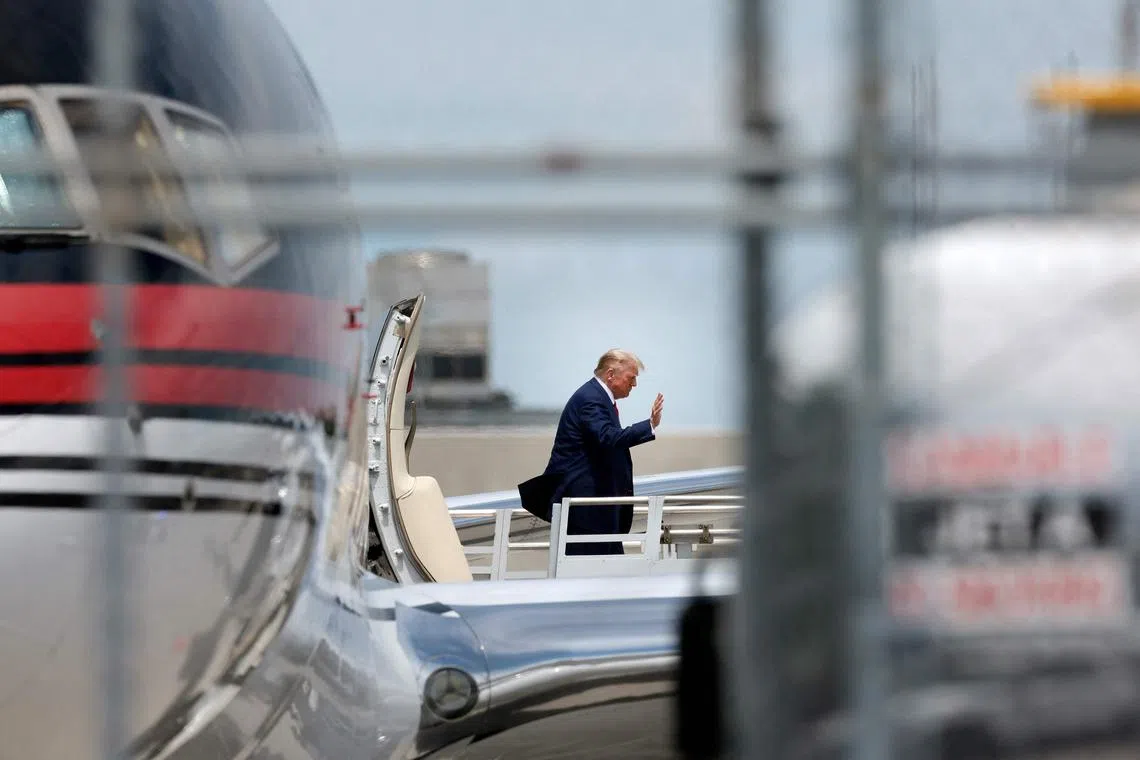Trump touched down in Miami in a private jet with his name emblazoned on the side. 
