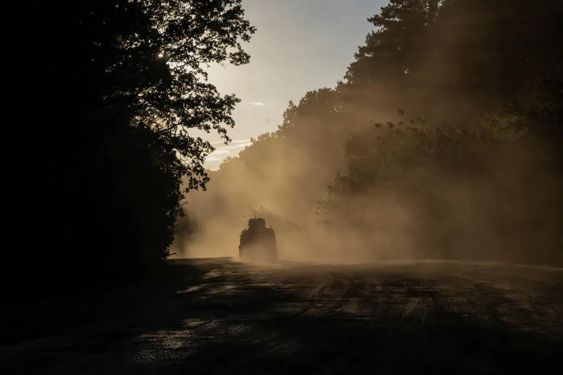 Ukrainian servicemen ride a military vehicle, amid Russia's attack on Ukraine, near the Russian border in Sumy region, Ukraine August 14, 2024. REUTERS/Viacheslav Ratynskyi/File Photo