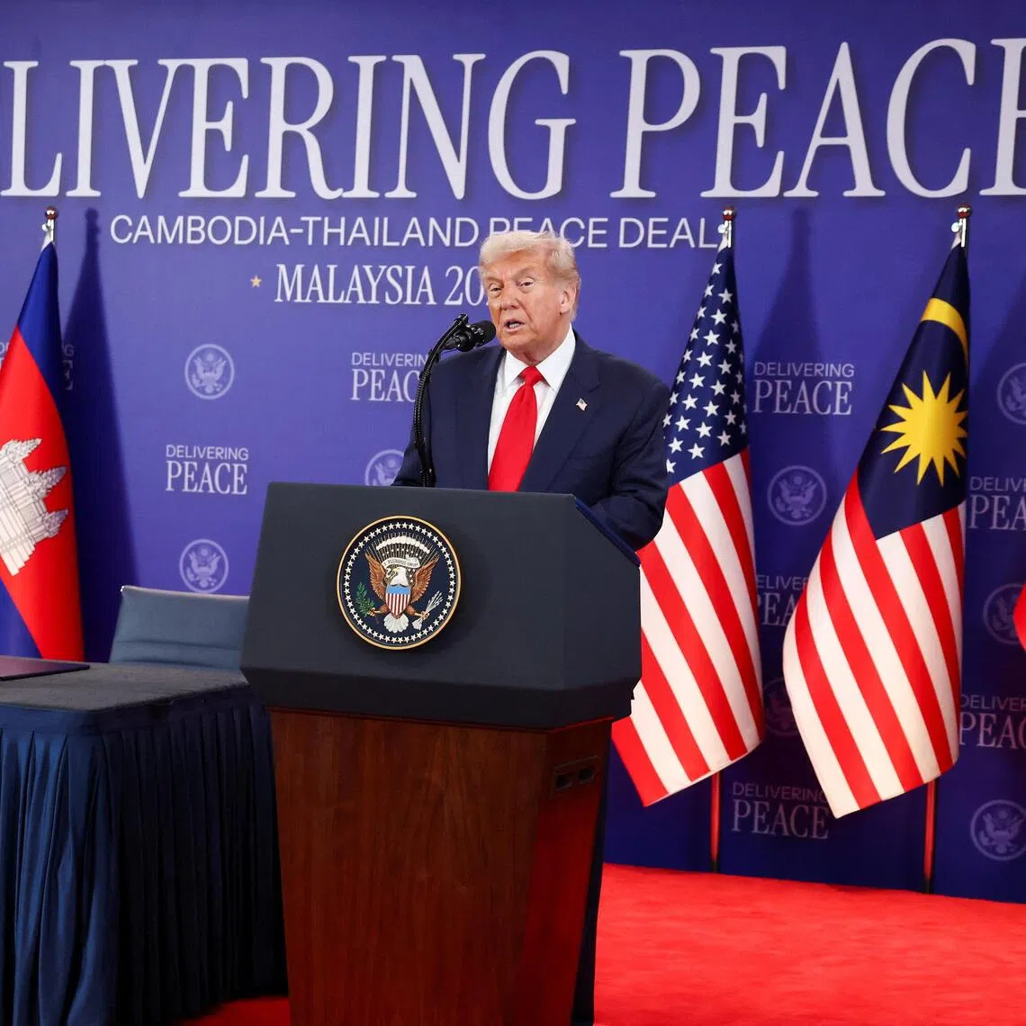 (From left) Thai Prime Minister Anutin Charnvirakul and Cambodian Prime Minister Hun Manet look on as US President Donald Trump speaks ahead of the signing of a ceasefire deal in Kuala Lumpur on Oct 26.