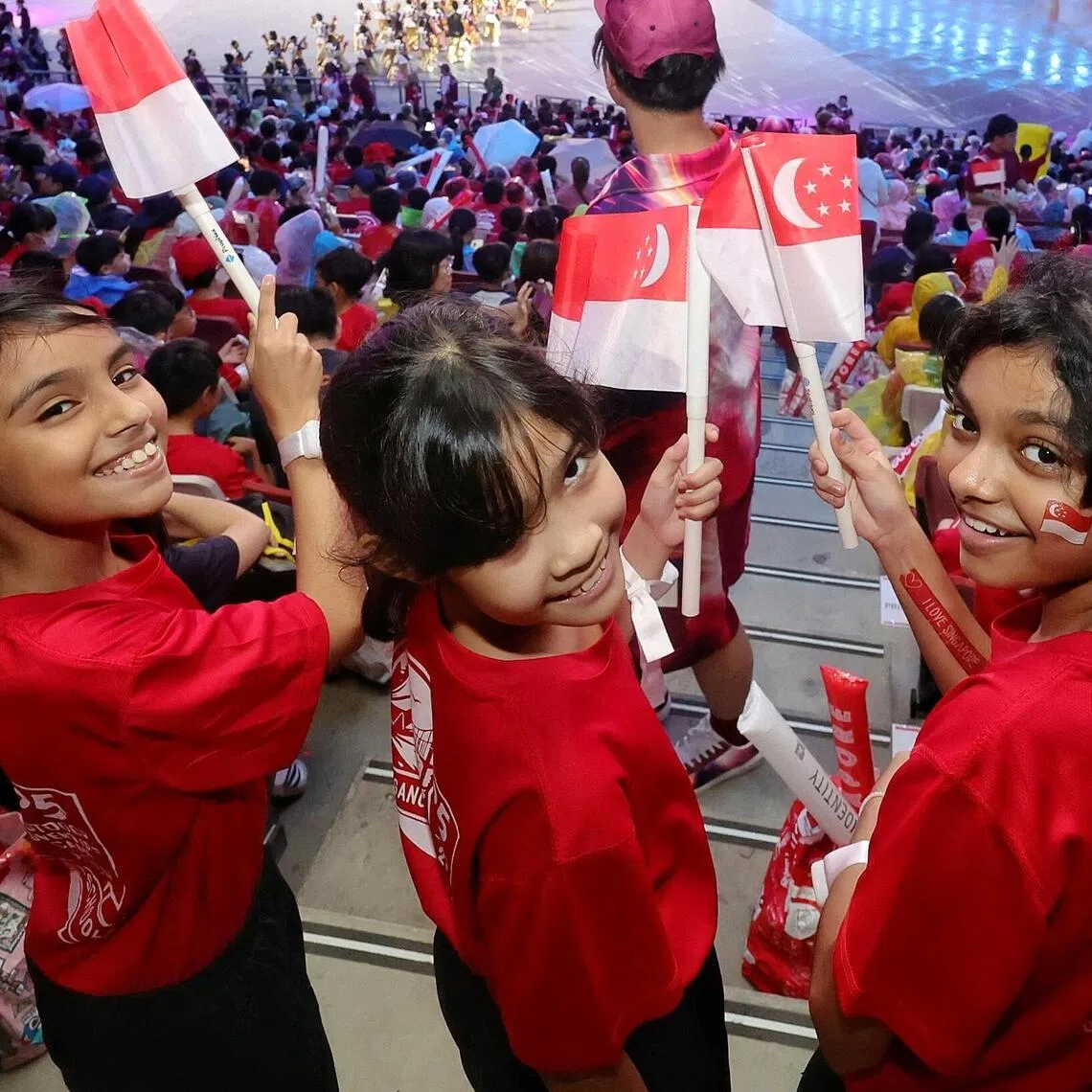 (From right) P5 Hougang Primary School pupils Fahirah Mohammed Shajahan, Amber Zarafyna Abdul Hakim, Yasmin Nadhirah Muhammad Ishaq at the National Education Show 1 at the National Stadium on July 11.