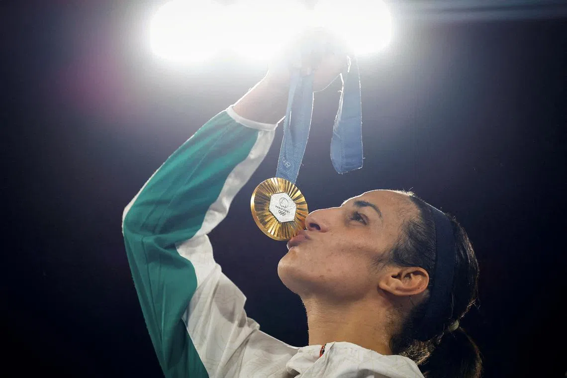 FILE PHOTO: Paris 2024 Olympics - Boxing - Women's 66kg - Victory Ceremony - Roland-Garros Stadium, Paris, France - August 09, 2024. Gold medallist Imane Khelif of Algeria kisses her medal. REUTERS/Peter Cziborra