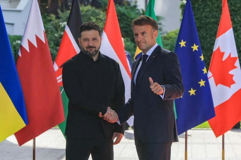 France's President Emmanuel Macron greets Ukraine's President Volodymyr Zelensky on June 16 ahead of the working session with G-7 leaders and Ukraine during the summit in Evian, France.