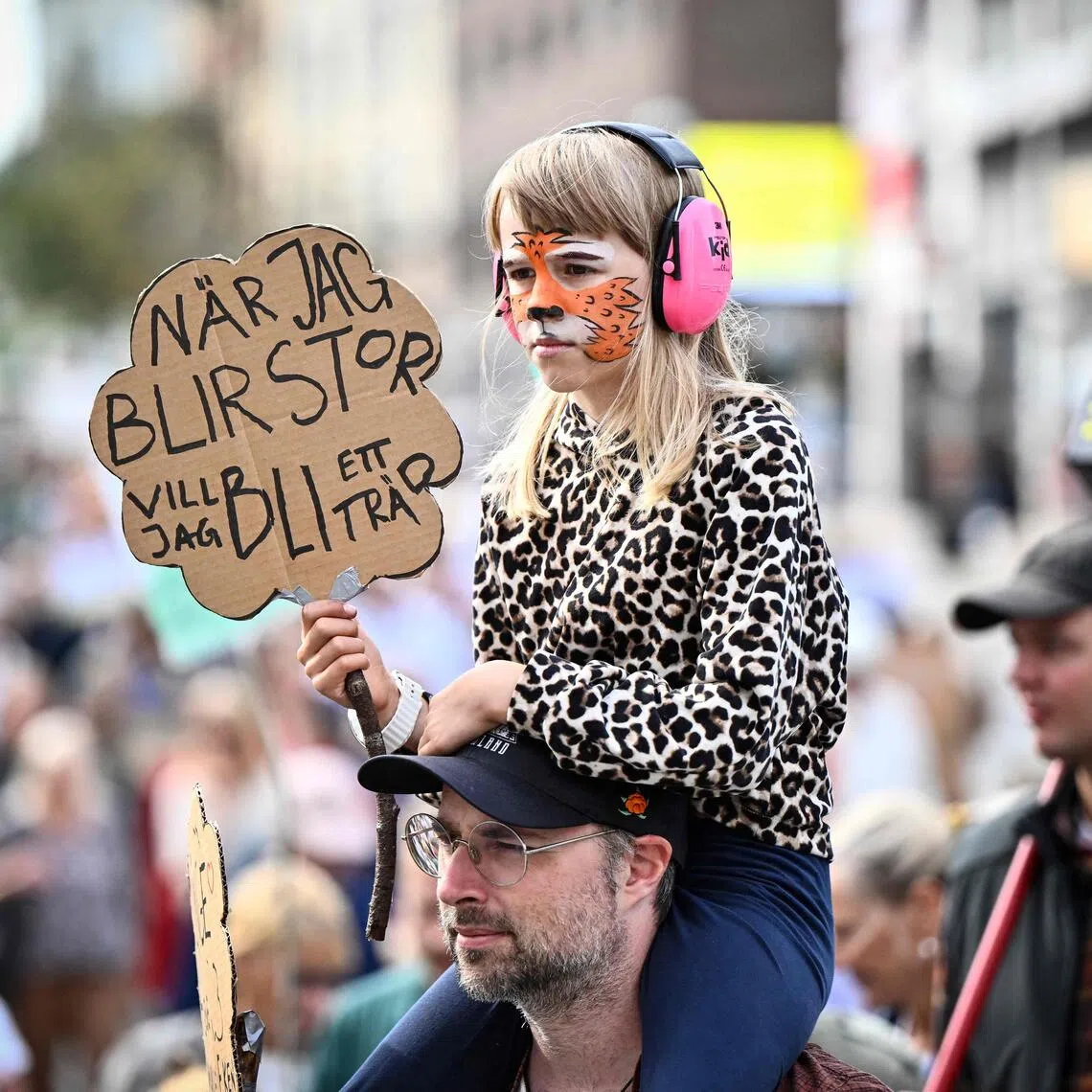 Protesters take part in a climate demonstration organised by the Swedish Society for Nature Conservation together with Rebel Moms, Rebel Dads and Researchers Desk in central Stockholm, Sweden, on Aug 23.