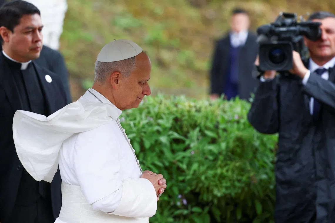 Pope Leo XIV prays during his visit to the archaeological site of Hippo Regius in Annaba, Algeria, April 14, 2026. REUTERS/Guglielmo Mangiapane