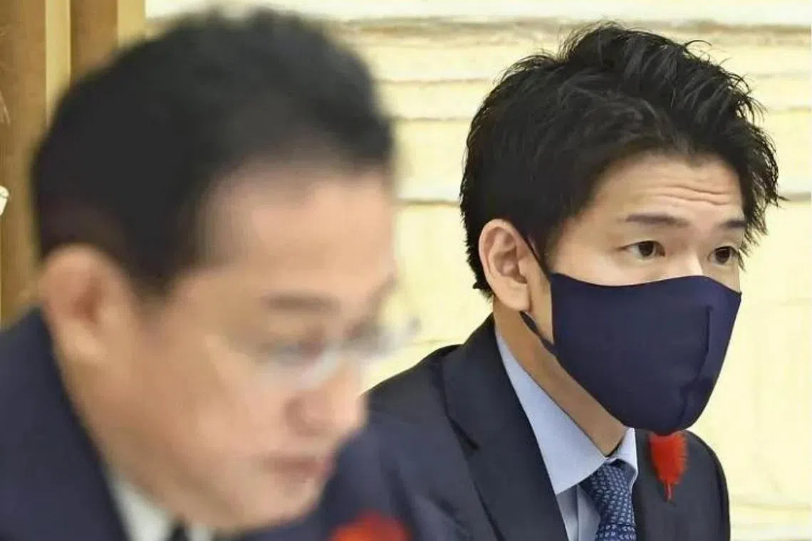 Japan's Prime Minister Fumio Kishida said his son Shotaro (right) was following his instructions and acting within his job as a secretary.