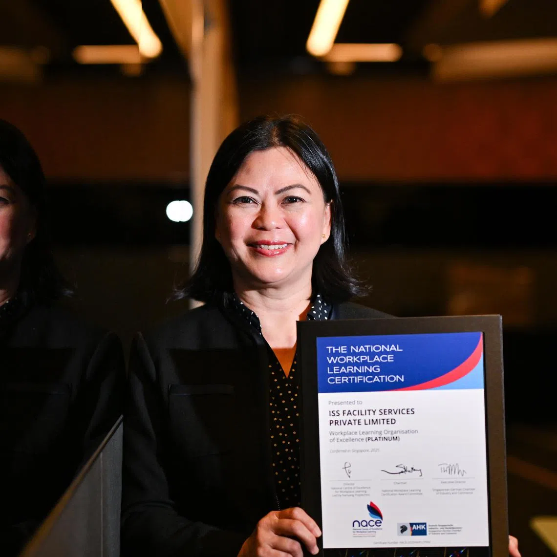 ST20250818-202596800422-Lim Yaohui-Shermaine Ang-smskills18/ 
Ms Gina Toh, 49, CEO of ISS Facility Services, Singapore (ISS Singapore), received the Workplace Learning Organisation of Excellence (Platinum) award from the National Centre for Workplace Excellence, the highest tier of the National Workplace Learning (NWpL) certifications.
The award was presented to ISS Singapore at the Human Capital Conference 2025 by guest-of-honour Dr Janil Puthucheary, Senior Minister of State, Ministry of Education and Ministry of Sustainability and the Environment, at The SkillsFuture Human Capital Conference, which marks the closing of SkillsFuture Festival 2025, at Suntec Singapore Convention & Exhibition Centre on Aug 18, 2025.
The event, themed “Transform Today, Lead Tomorrow – Strengthen Business Through People”, is jointly organised by the Singapore Business Federation (SBF) and the National Centre of Excellence for Workplace Learning at Singapore Polytechnic (NACE@SP), with the support of SkillsFuture Singapore and Lifelong Learning Singapore.
(ST PHOTO: LIM YAOHUI)