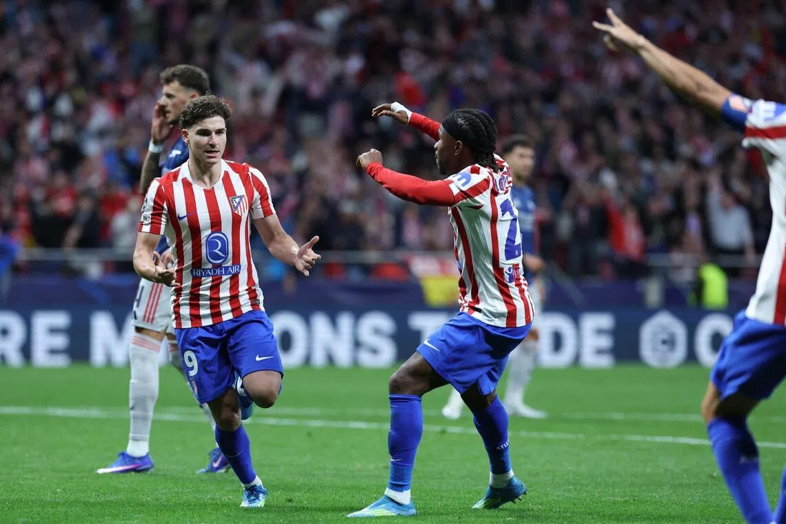 Atletico Madrid's Argentinian forward Julian Alvarez celebrates scoring the equaliser in the 1-1 Champions League semi-final, first-leg draw against Arsenal at the Metropolitano stadium in Madrid on April 29, 2026.