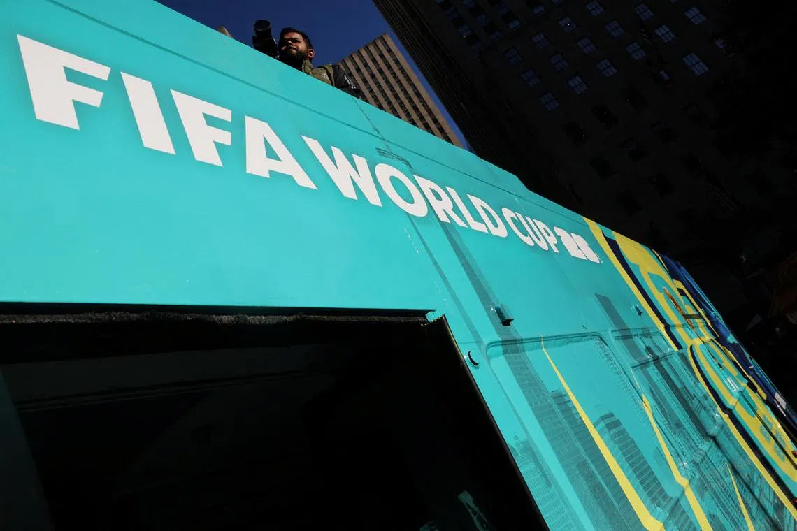 A bus advertisement for FIFA World Cup 26 New York and New Jersey at Rockefeller Center in New York City.