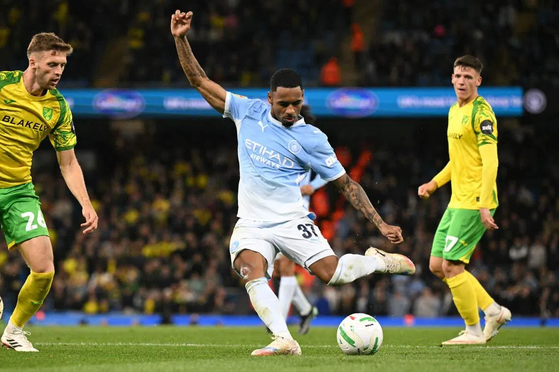 Manchester City’s Brazilian midfielder Allan Elias scores the team’s third goal.