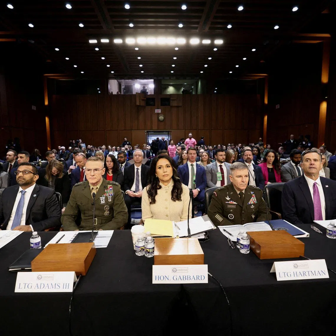 FILE PHOTO: FBI Director Kash Patel, Defense Intelligence Agency Director Lt. Gen. James Adams, Director of National Intelligence (DNI) Tulsi Gabbard, Acting National Security Agency Director Lt. Gen. William Hartman and CIA Director John Ratcliffe testify before a Senate Intelligence Committee hearing on Capitol Hill in Washington, D.C., U.S., March 18, 2026.  REUTERS/Kevin Lamarque/File Photo