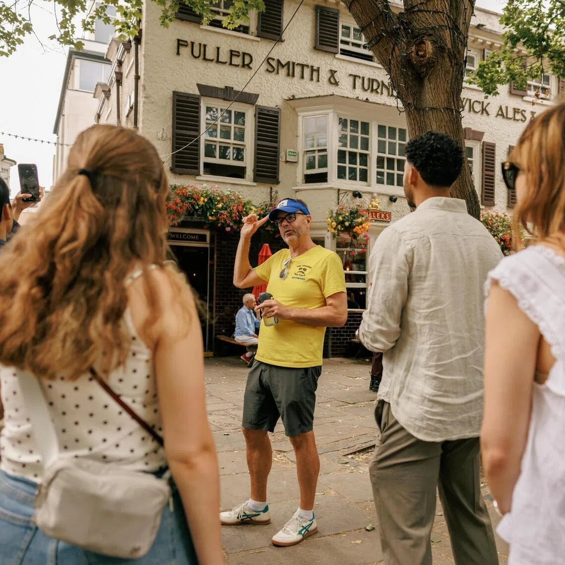 Matt Allard leads a tour of popular Ted Lasso locations in the Richmond-upon-Thames suburb of London on July 26.