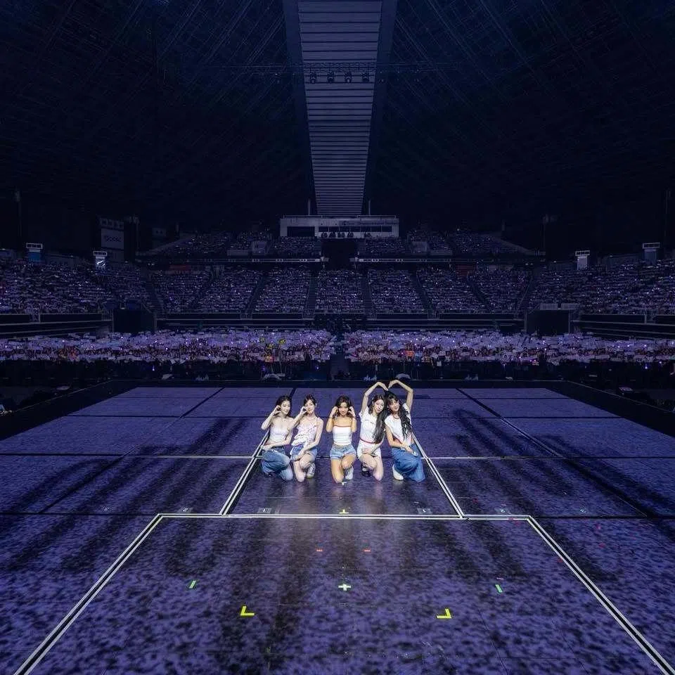 South Korean girl group I-dle, consisting (from left) Shuhua, Yuqi, Soyeon, Miyeon and Minnie taking a photo with fans during their concert at the Singapore Indoor Stadium on June 13.