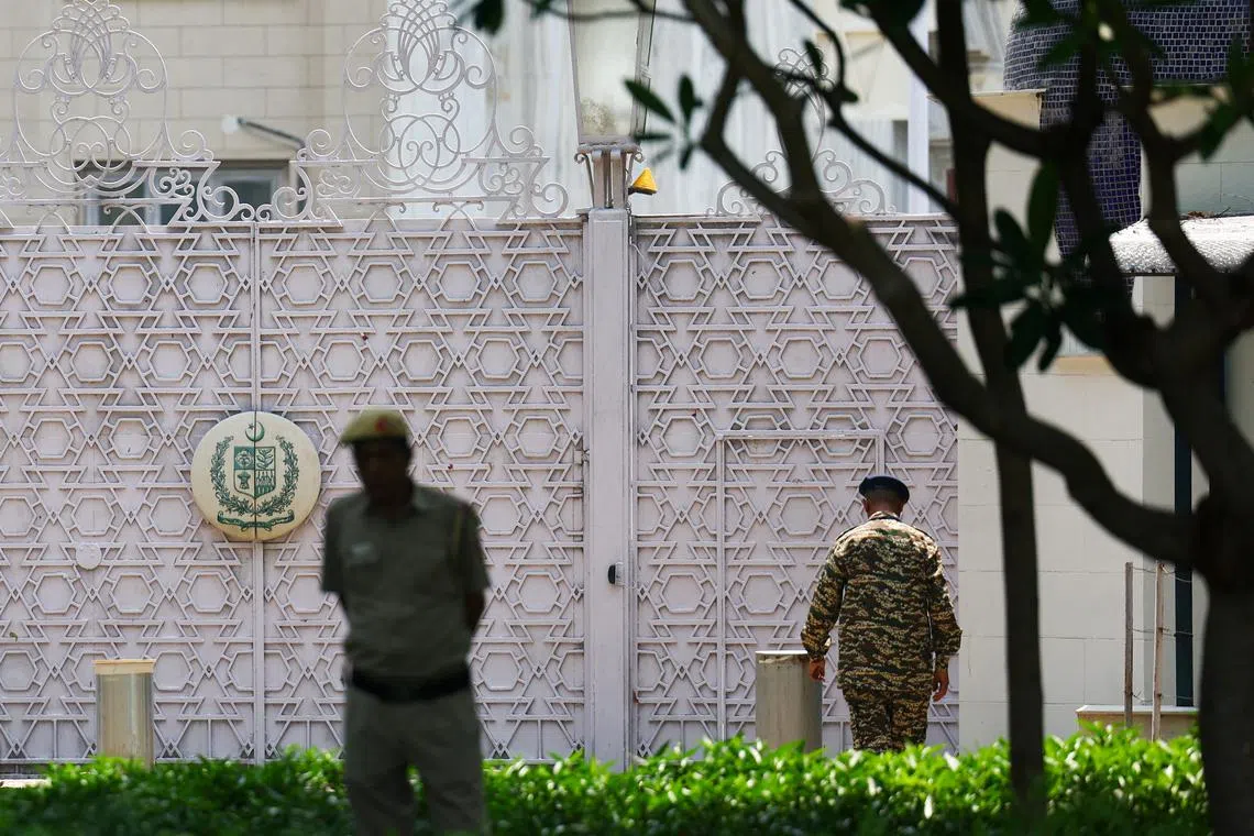 Security personnel stand outside the gate of Pakistan High Commission in New Delhi, India, May 8, 2025. REUTERS/Anushree Fadnavis