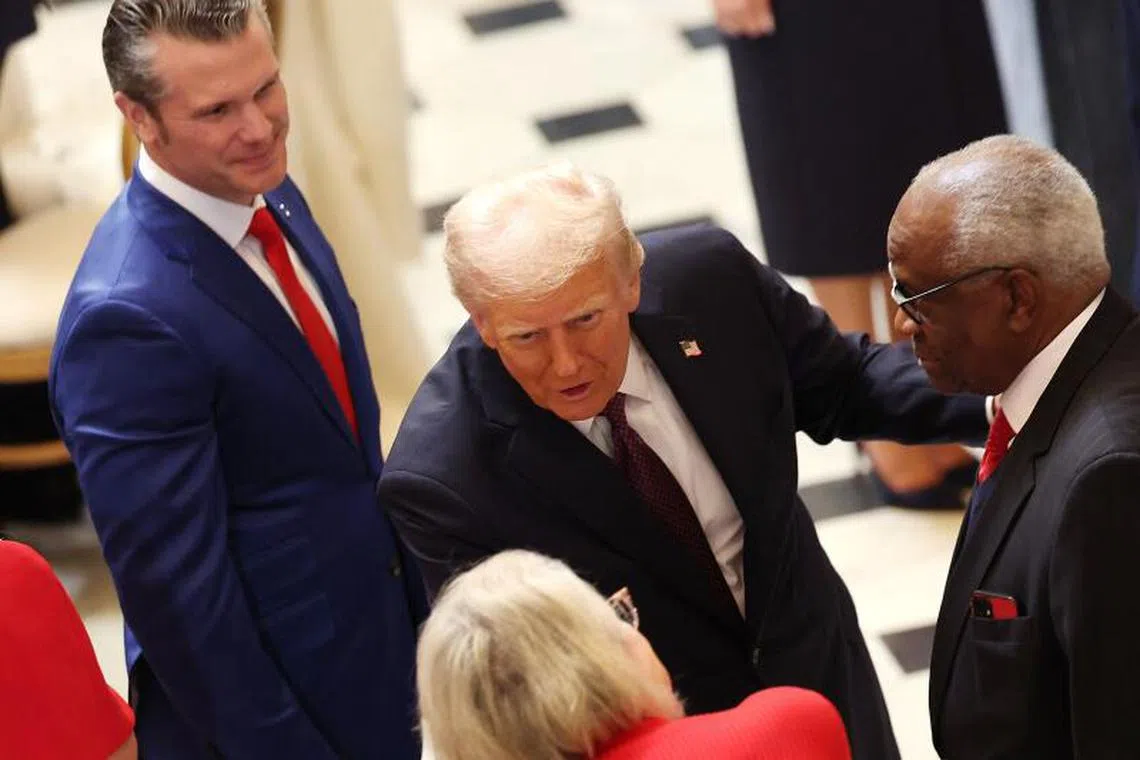WASHINGTON, DC - JANUARY 20: U.S. President Donald Trump greets U.S. Associate Supreme Court Justice Clarence Thomas (R) and his wife Virginia Thomas along with Pete Hegseth, President-elect Donald Trump's nominee for Secretary of Defense during the luncheon following inauguration at the U.S. Capitol on January 20, 2025 in Washington, DC. Donald Trump takes office for his second term as the 47th president of the United States. Kevin Dietsch/Getty Images/AFP (Photo by Kevin Dietsch / GETTY IMAGES NORTH AMERICA / Getty Images via AFP)

