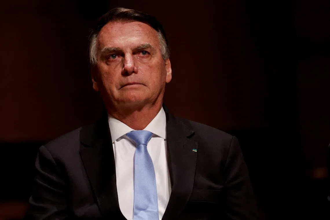 FILE PHOTO: Brazil's former President Jair Bolsonaro reacts at an event at the Municipal Theatre in Sao Paulo, Brazil March 25, 2024. REUTERS/Amanda Perobelli/File Photo