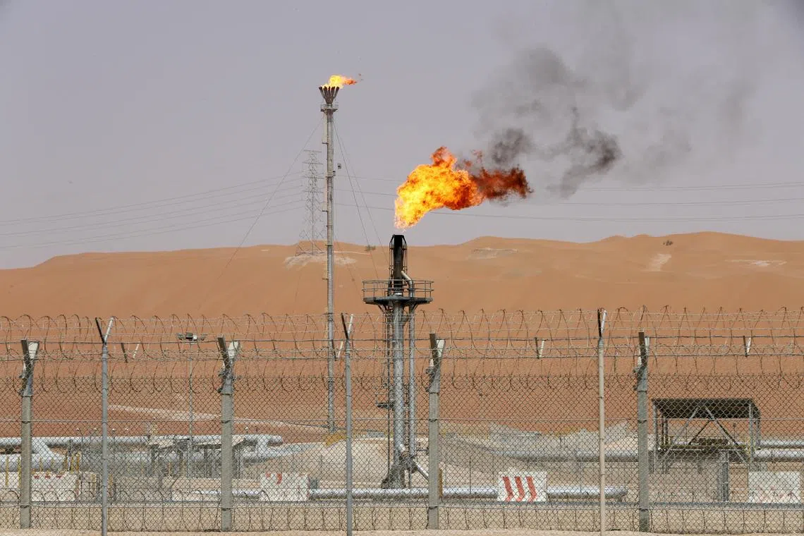 FILE PHOTO: Flames are seen at the production facility of Saudi Aramco's Shaybah oilfield in the Empty Quarter, Saudi Arabia May 22, 2018. Picture taken May 22, 2018. REUTERS/Ahmed Jadallah/File Photo