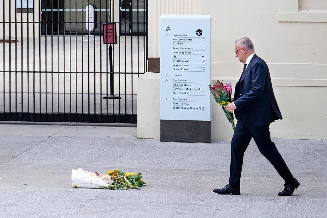 Australia's Prime Minister Anthony Albanese laying flowers at the scene of the country's deadliest mass shooting in nearly three decades, in Bondi Beach on Jan 8.