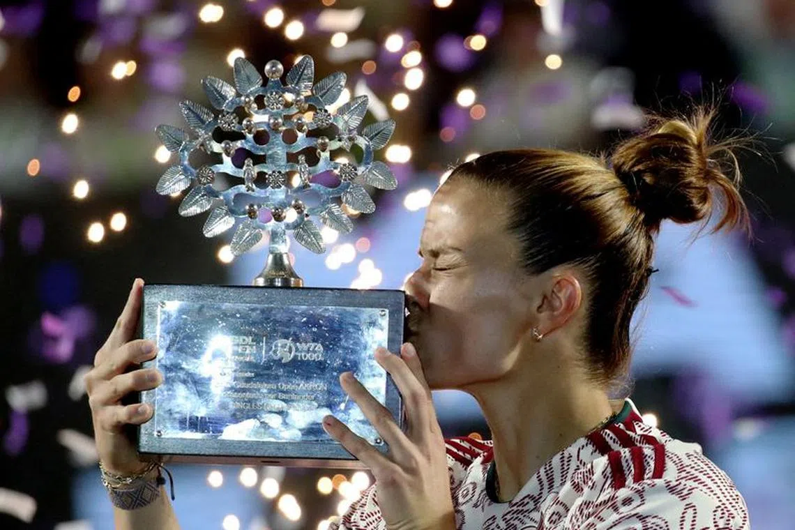 Tennis - WTA 1000 - Guadalajara Open - Panamerican Tennis Center, Guadalajara, Mexico - September 23, 2023 Greece's Maria Sakkari celebrates with the trophy after winning her final match against Caroline Dolehide of the U.S. REUTERS/Henry Romero