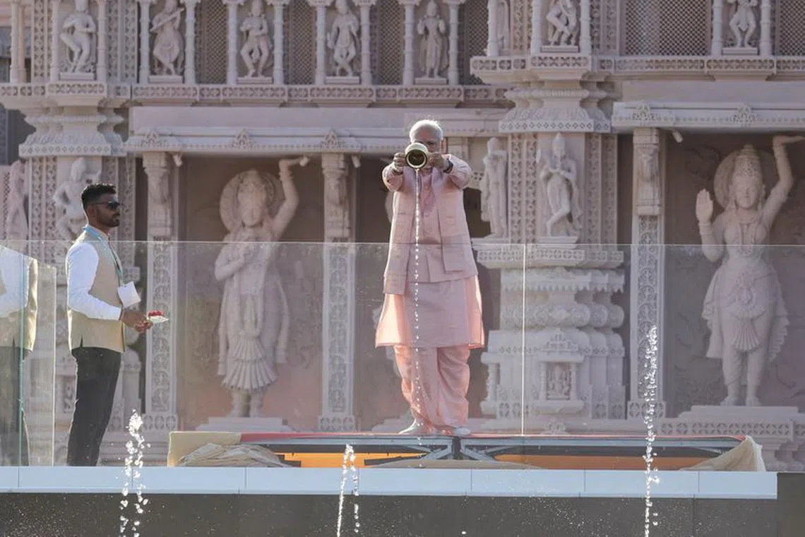 India's Prime Minister Narendra Modi performs a Hindu water ritual, as he attends the inauguration of the BAPS Hindu temple in Abu Dhabi, United Arab Emirates, February 14, 2024. REUTERS/Amr Alfiky