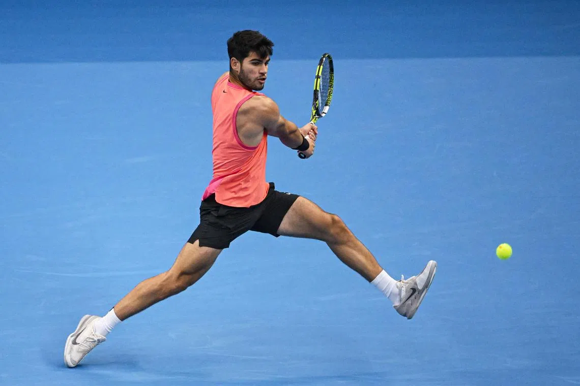 Spain’s Carlos Alcaraz hitting a return to Russia's Karen Khachanov during their men’s singles quarter-final match at the China Open tennis tournament in Beijing on Sept 30. Alcaraz won 7-5, 6-2 to set up a semi-final against Daniil Medvedev.