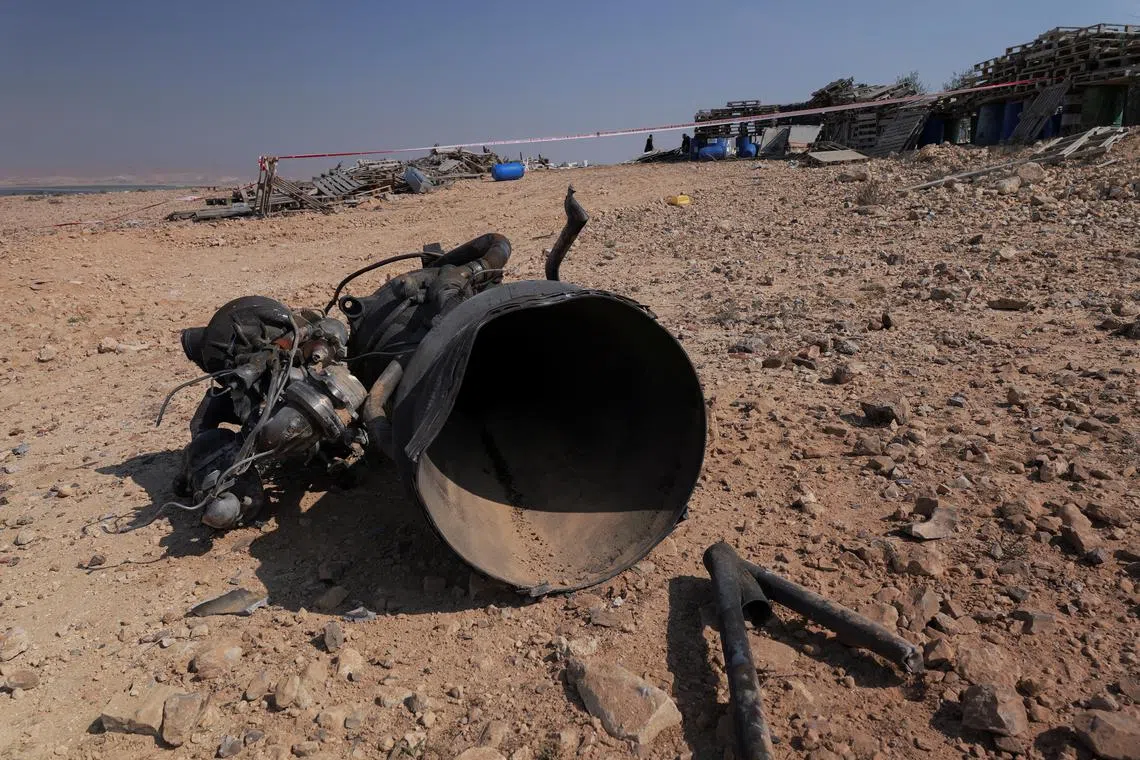 FILE PHOTO: The remains of a rocket booster that, according to Israeli authorities critically injured a 7-year-old girl, after Iran launched drones and missiles towards Israel, near Arad, Israel, April 14, 2024. REUTERS/Christophe van der Perre/File Photo