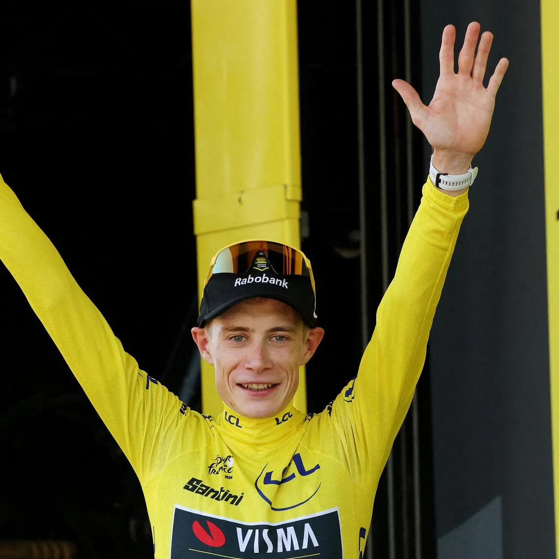 Cycling - Tour de France - Stage 1 - Barcelona to Barcelona - Barcelona, Spain - July 4, 2026 Team Visma | Lease a Bike's Jonas Vingegaard celebrates on the podium wearing the yellow jersey after stage 1 REUTERS/Gonzalo Fuentes