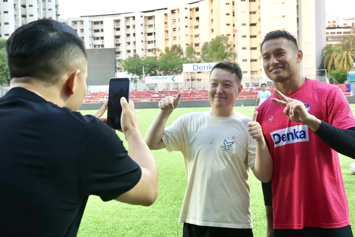 Hassan Sunny posing for a photo with a fan after a training session at Jurong East Stadium on June 13. 