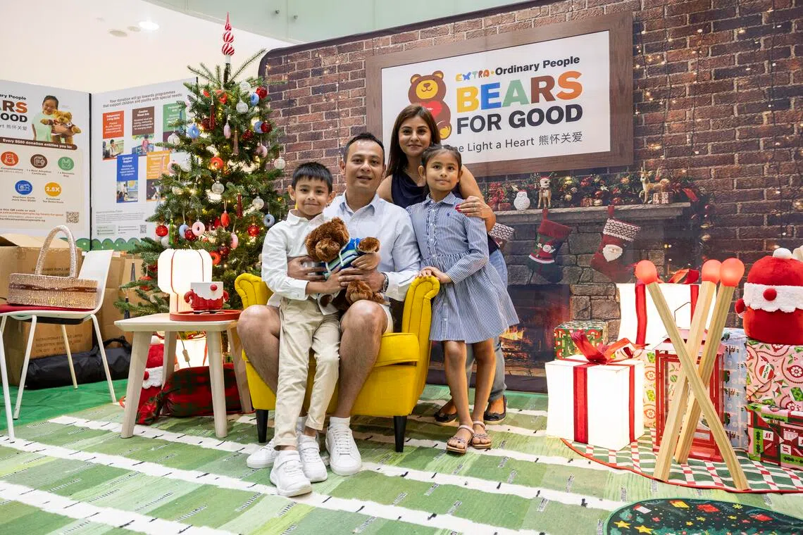 Mr Aarvin Giovanni, Ms Gurpreet Kaur and their children Ashleen and Aaryan at the Bears for Good charity roadshow.