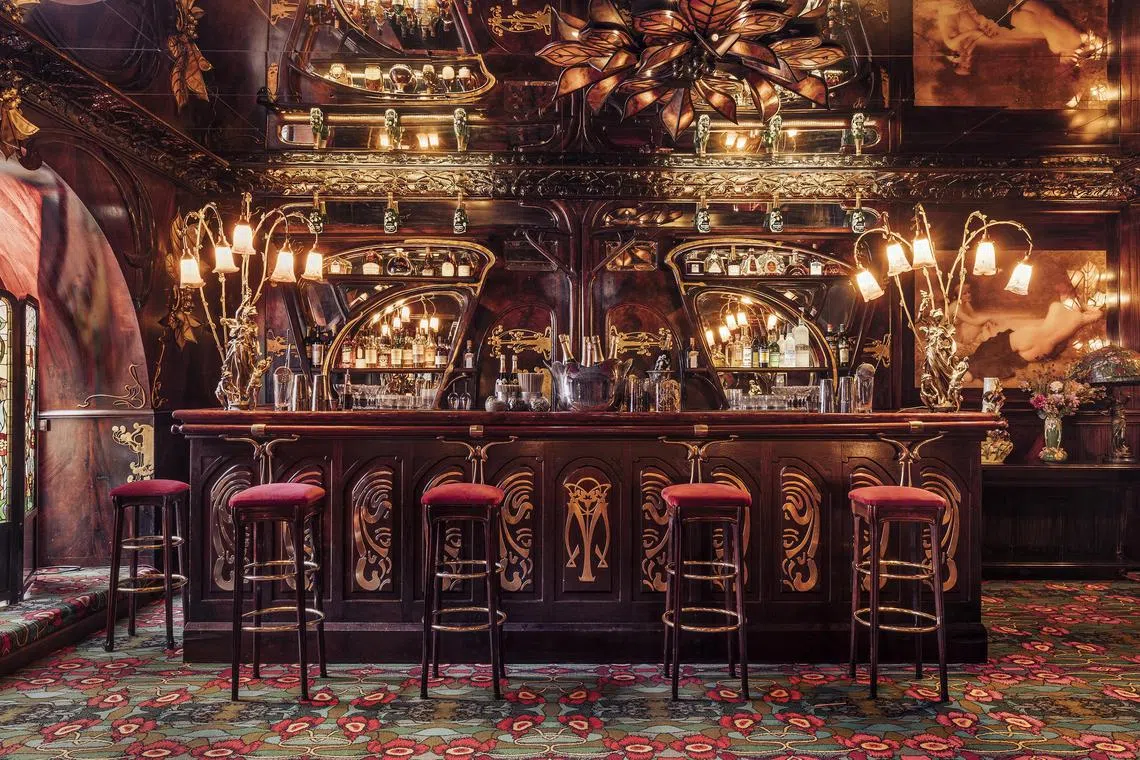 A photo, provided by Romain Ricard, shows that inside Maxim's are bronze elements, velvet upholstery, stained glass and other details characteristic of the Art Nouveau style. 