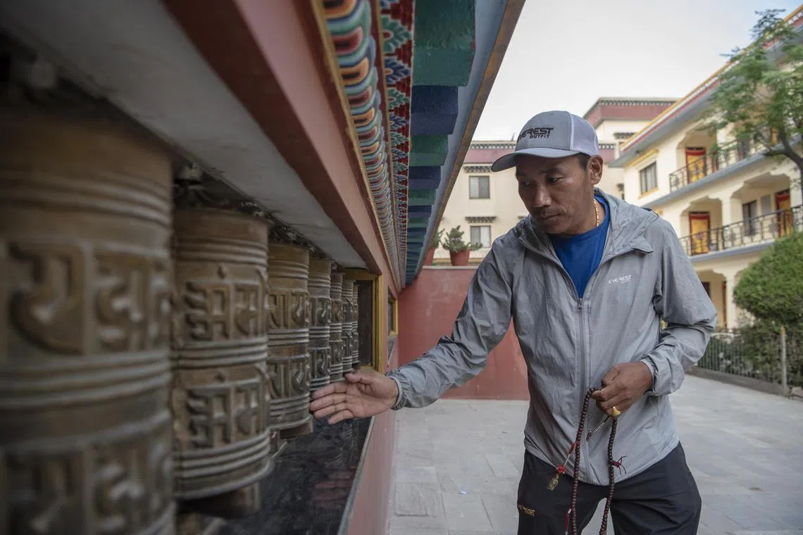 Mr Kami Rita Sherpa has scaled Mount Everest a record 26 times., but he's setting a different path for his children.