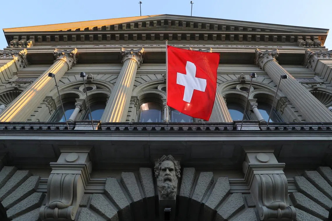 FILE PHOTO: Switzerland's national flag flies at the Swiss Federal Palace (Bundeshaus), the seat of the parliament and the government, in Bern, Switzerland March 18, 2021. Picture taken March 18, 2021.  REUTERS/Arnd WIegmann/File Photo