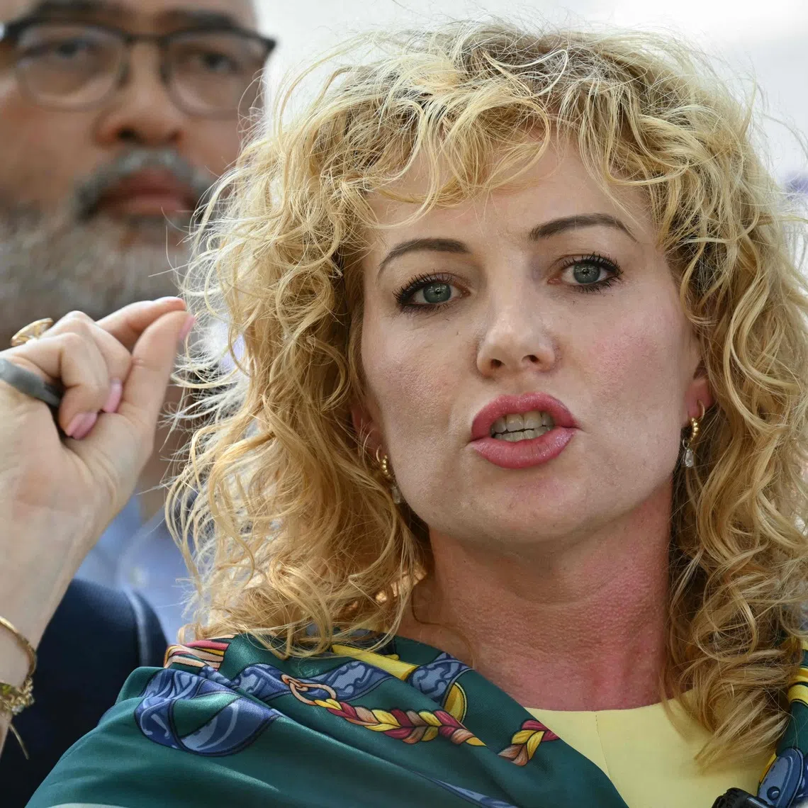 Kate Lincoln-Goldfinch, attorney representing the family of Wilber Rafael Garces Perez, speaks during a news conference a day after Perez, a Venezuelan national, was shot and wounded during a US Immigration and Customs Enforcement (ICE) operation in Austin, Texas, on September 21, 2026. Venezuelan migrant Wilber Rafael Garces Perez, 28, was rushed to a hospital after he was shot on September 20 by a US immigration agent, local officials said, voicing outrage and demanding an investigation into what happened. The man was in stable but serious condition with one gunshot wound to the torso suffered during a foot pursuit, the officials said, stressing that information on what occurred was "very preliminary." (Photo by RONALDO SCHEMIDT / AFP)