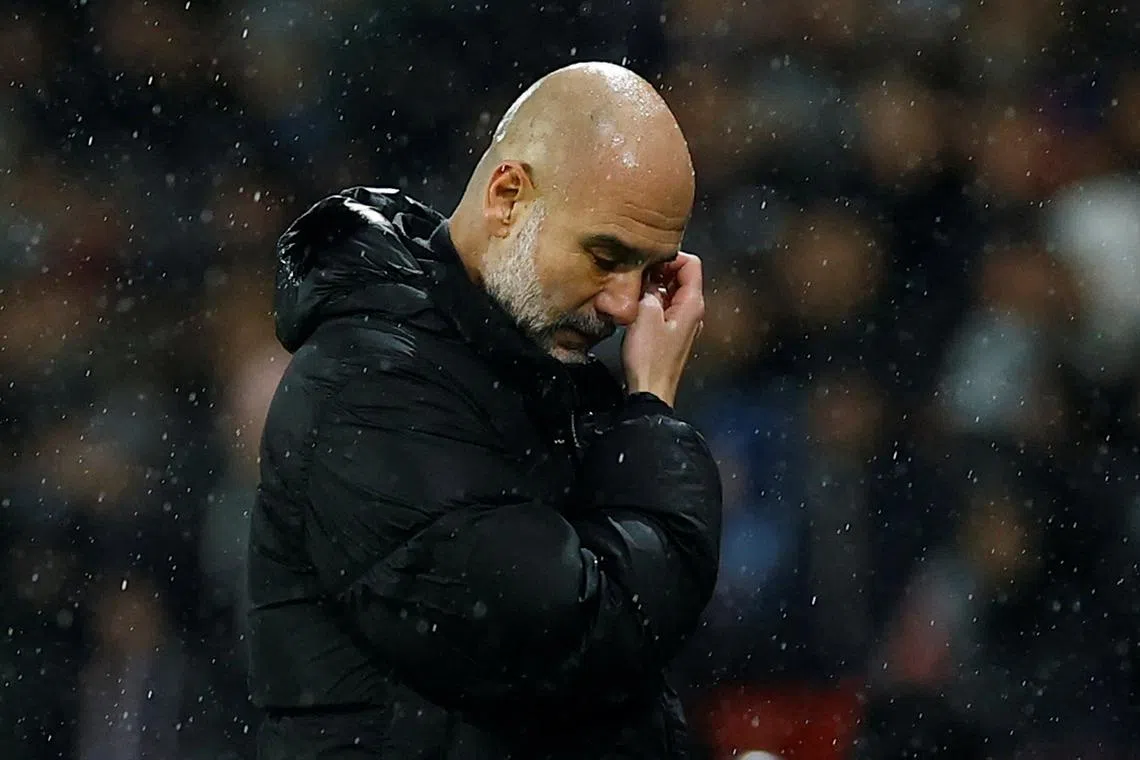 Soccer Football - Champions League - Paris St Germain v Manchester City - Parc des Princes, Paris, France - January 22, 2025 Manchester City manager Pep Guardiola reacts REUTERS/Stephanie Lecocq/ File Photo