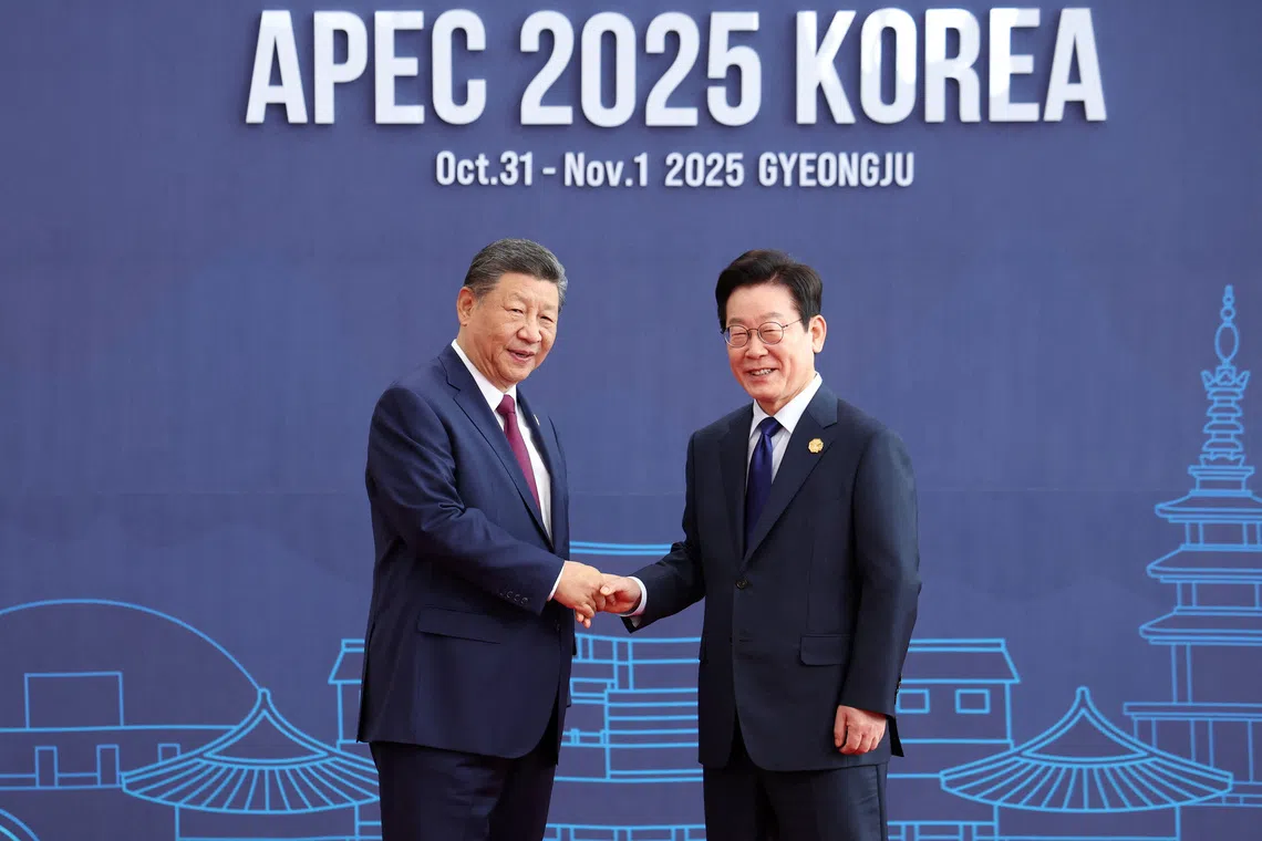 China's President Xi Jinping and South Korea's President Lee Jae Myung pose for photographs during the Asia-Pacific Economic Cooperation (APEC) summit in Gyeongju, South Korea, October 31, 2025.   Yonhap via REUTERS