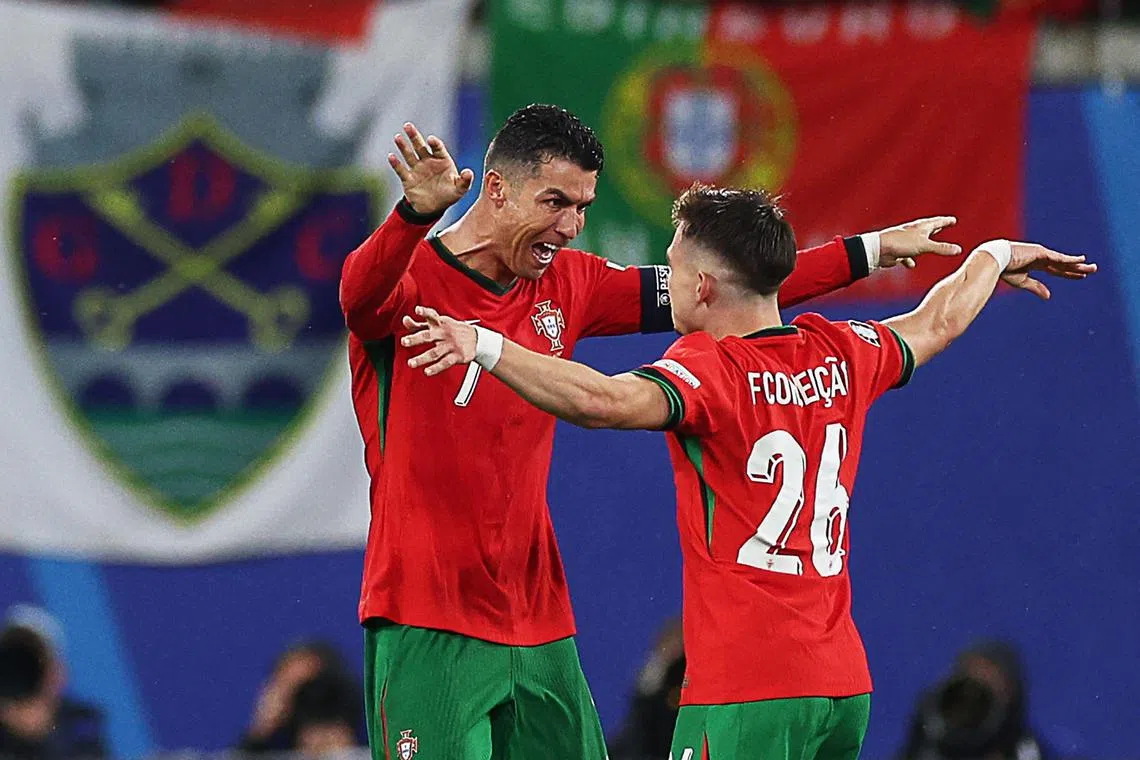 Portugal captain Cristiano Ronaldo celebrating with substitute Francisco Conceicao, who scored a stoppage-time winner to help them beat the Czech Republic 2-1.