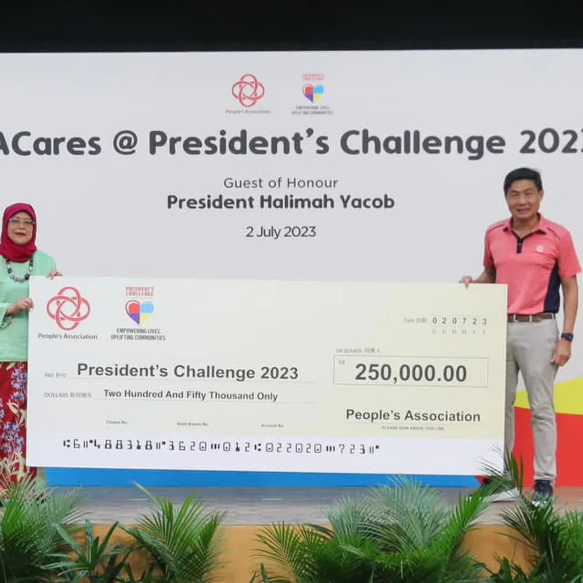 President Halimah Yacob received a cheque from PA at the Hong Kah North Community Centre on July 2.