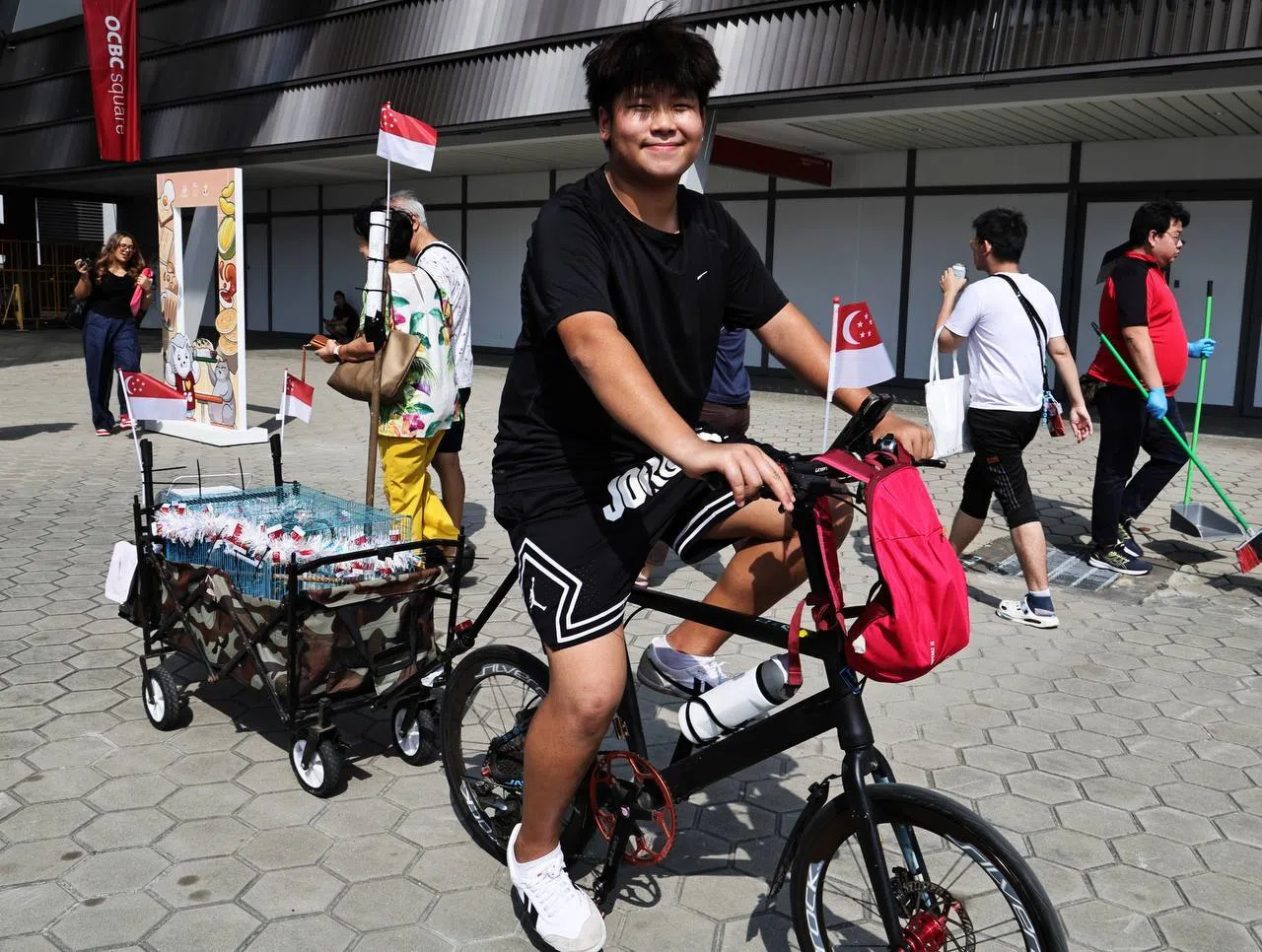 Asher Ang with his pet birds.