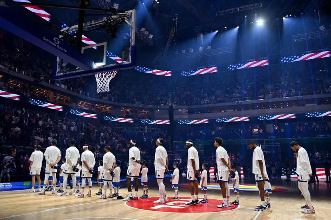 Basketball - FIBA World Cup 2023 - First Round - Group C - United States of America v New Zealand - Mall of Asia Arena, Manila, Philippines - August 26, 2023 United States players line up during the national anthems before the match REUTERS/Lisa Marie David