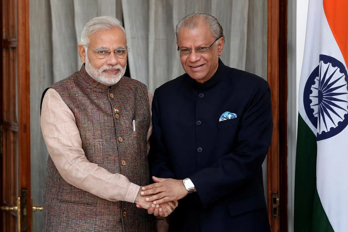 FILE PHOTO: India's Prime Minister Narendra Modi (L) shakes hands with his Mauritian counterpart Navinchandra Ramgoolam before the start of their bilateral meeting in New Delhi May 27, 2014.  REUTERS/Adnan Abidi/File Photo