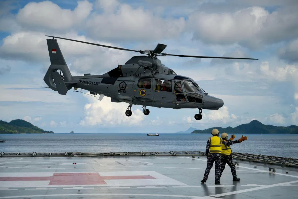 An Indonesia's AS565 Panther helicopter takes off from the hospital ship Radjiman Wedyodiningrat during the Asean Solidarity Exercise Natuna 2023.
