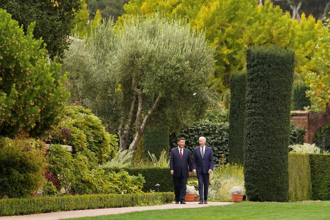 President Joe Biden walks with President Xi Jinping at Filoli estate in Woodside, California, on Nov 15, 2023.