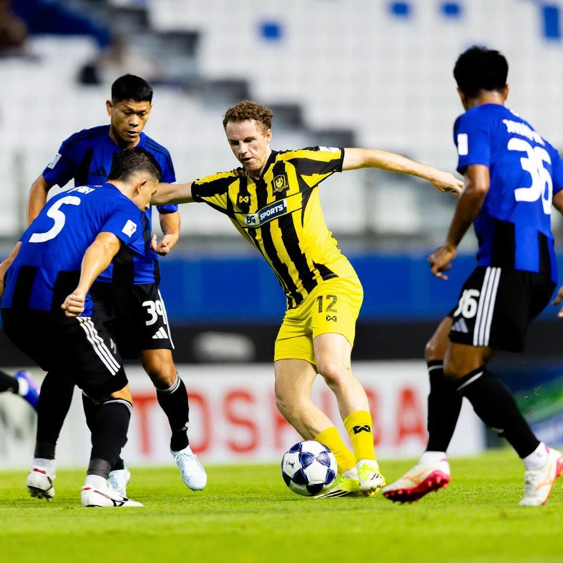 BG Tampines Rovers attacker Trent Buhagiar, surrounded by (from right) Bangkok United's Jakkapan Praisuwan Pokklaw Anan and Philipe Maia, grabs a goal for the Stags in their 2-1 loss in their AFC Champions League quarter-final first-leg match.