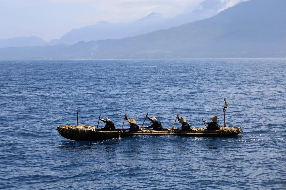A dugout canoe with four men and one woman paddling is pictured during a crossing across a region of the East China Sea from near Ushibi, Taiwan to Yonaguni Island, traversing the Kuroshio current, in this handout image released on June 25, 2025. Yousuke Kaifu/Handout via REUTERS