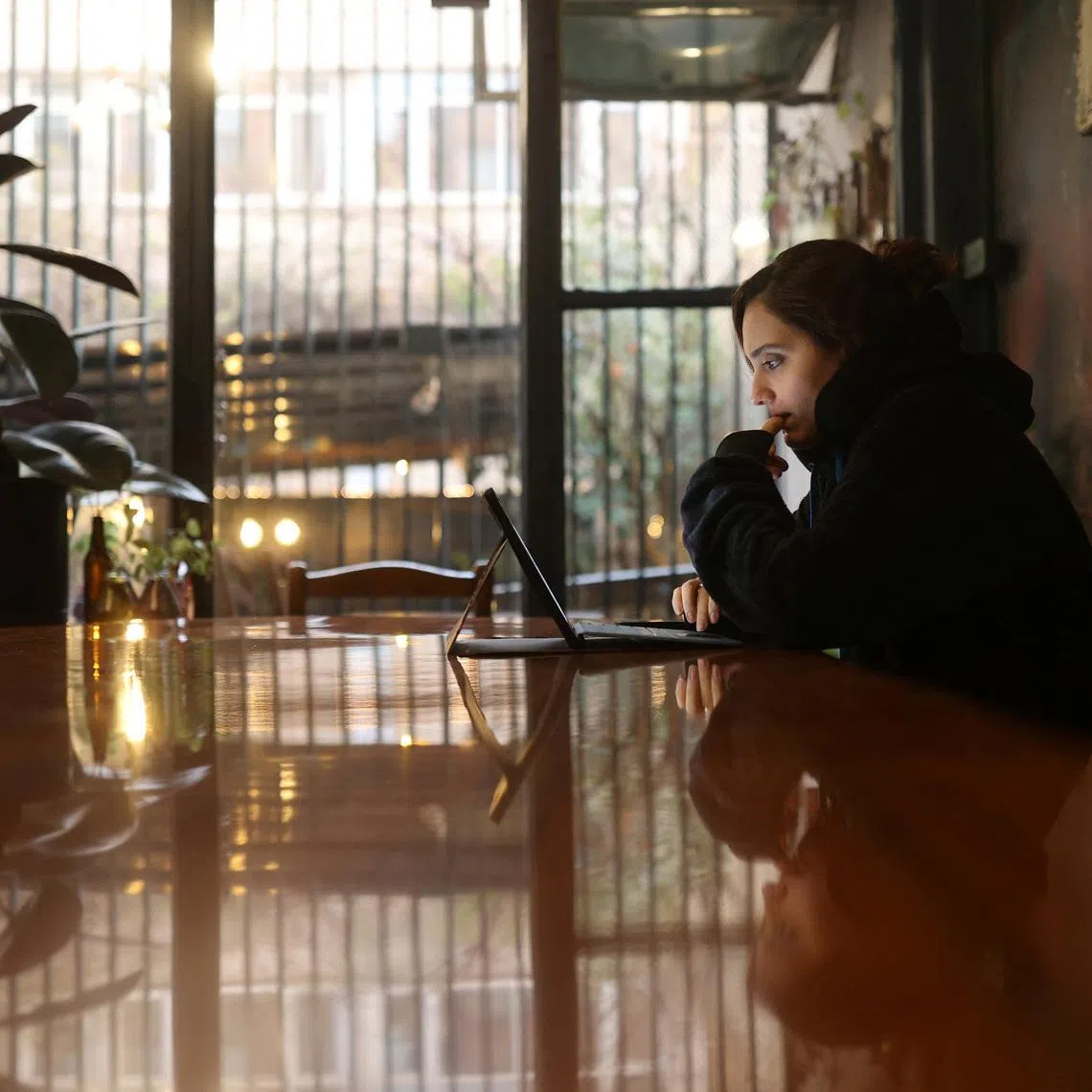 An Iranian woman, Samaneh, tries to connect to the internet in Tehran, Iran.